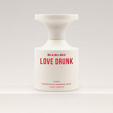 Perfume bottle labeled 'LOVE DRUNK' by BLA BLI BLU on a white background