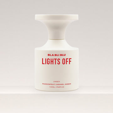 Perfume bottle labeled 'BLA BLI BLU LIGHTS OFF' on a white background