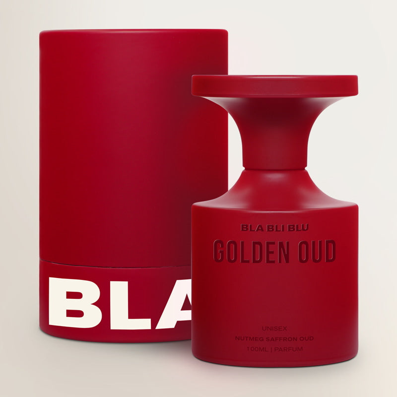 Red perfume bottle and packaging with 'BLA BLU' branding on a light background