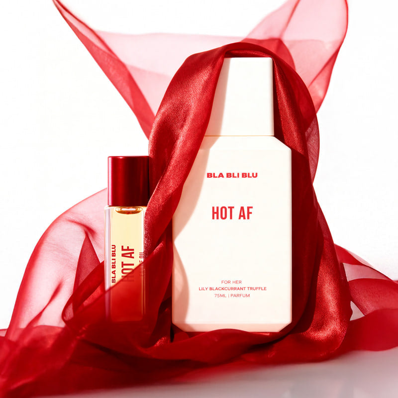 Perfume set with 'BLA BLU HOT AF' branding on a light gray background