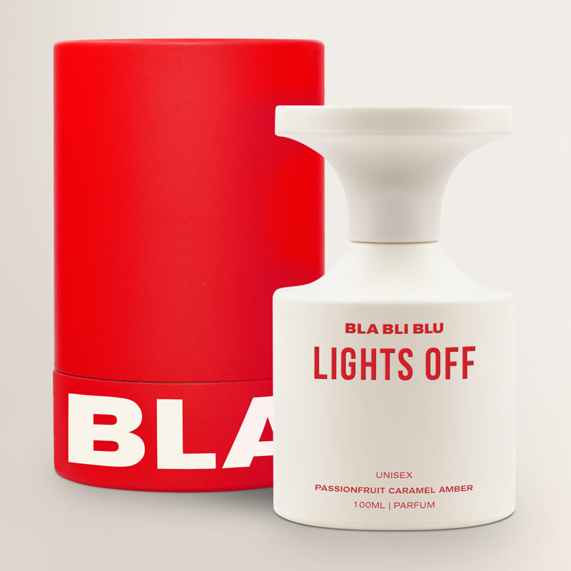 Red and white 'BLA BLU' perfume bottles on a light gray background