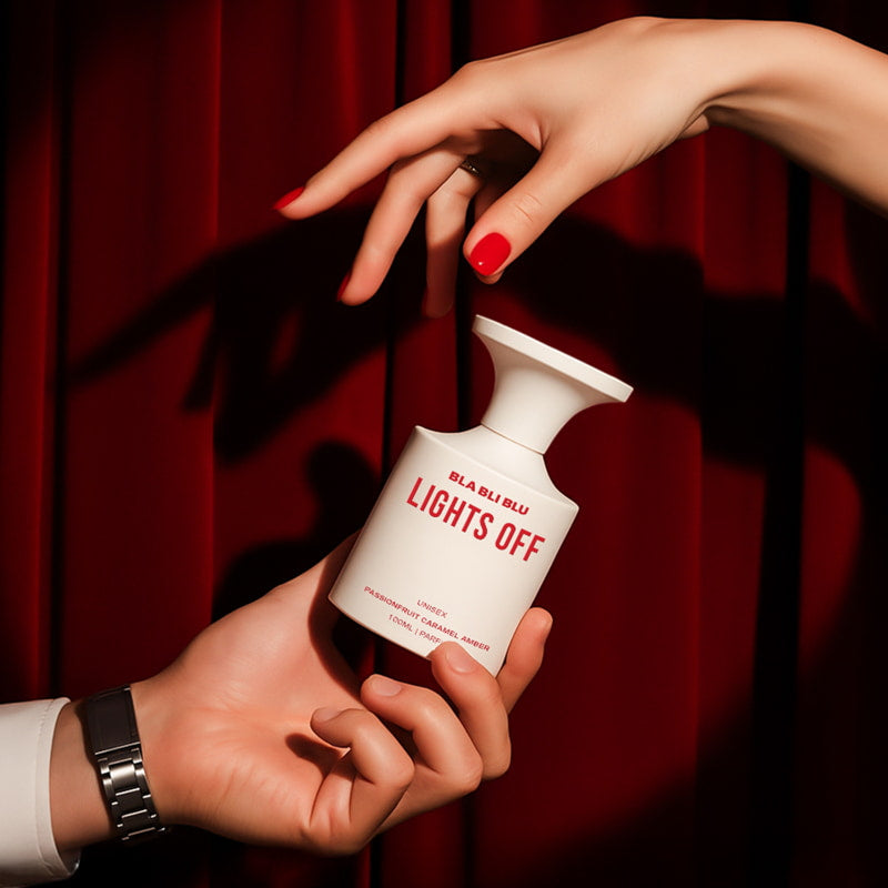 Perfume bottle labeled 'BLA BLI BLU LIGHTS OFF' on a white background