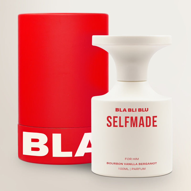 Red and white 'BLA BLI BLU' perfume bottle on a light gray background